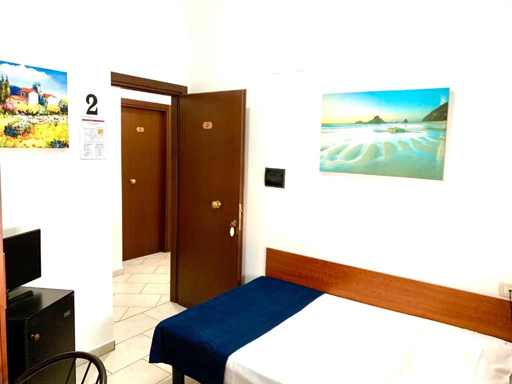 Posteľ alebo postele v izbe v ubytovaní Hotel Alessander