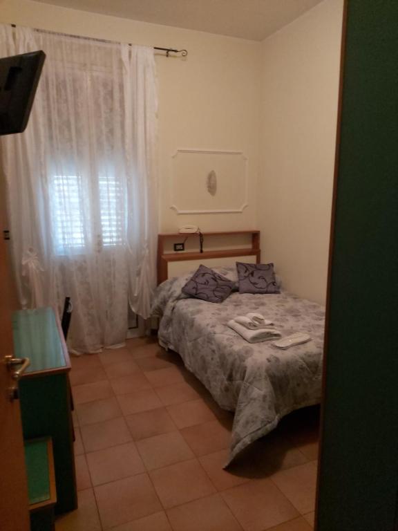 Postel nebo postele na pokoji v ubytování Hotel La Torre