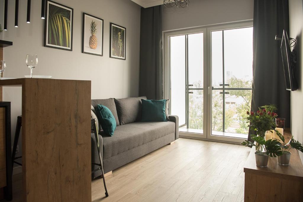 Posedenie v ubytovaní Wola Loft Apartment