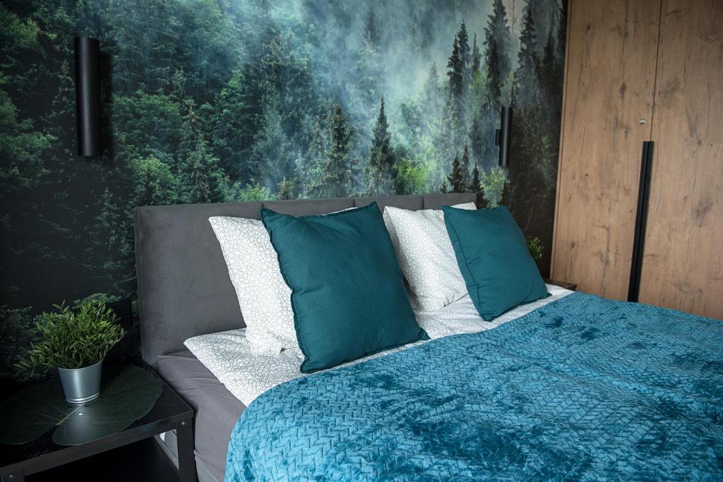 Posteľ alebo postele v izbe v ubytovaní Wola Loft Apartment