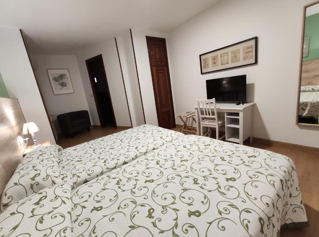 Cama o camas de una habitación en Hostal-Restaurante Paris