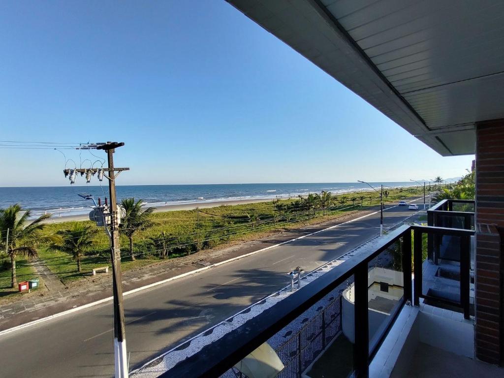 a view of the beach from the balcony of a building at Gaivotas · Para você, toda a comodidade da beira da praia. in Matinhos
