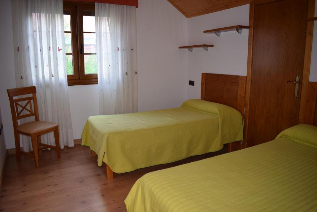 Cama o camas de una habitación en Apartamentos VIDA Corcubión