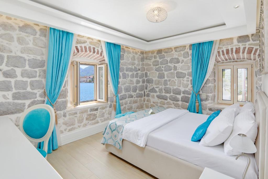 Ein Bett oder Betten in einem Zimmer der Unterkunft Hotel Libertas