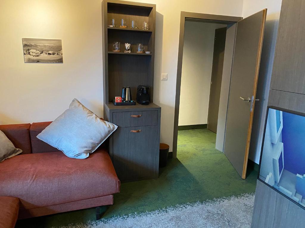 TV a/nebo společenská místnost v ubytování Hotel Les Etagnes