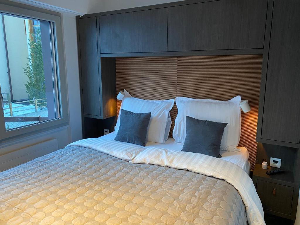 Postel nebo postele na pokoji v ubytování Hotel Les Etagnes