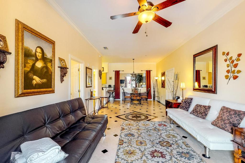 a living room with a couch and a ceiling fan at South Walton Condos II in Inlet Beach