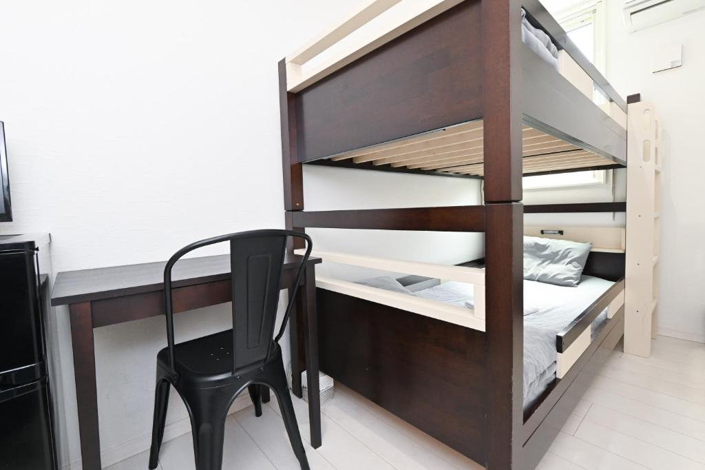 Postel nebo postele na pokoji v ubytování RUMa INN Rokugoudote