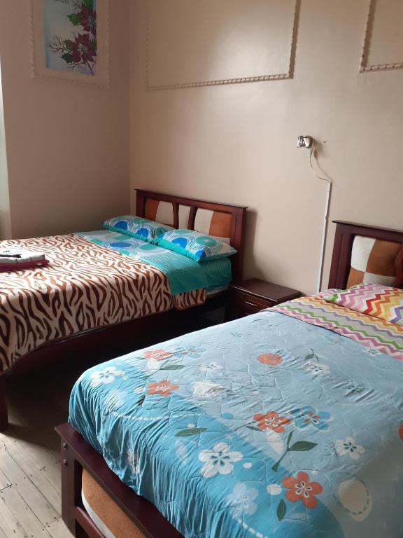 Postel nebo postele na pokoji v ubytování Hostal Mediodia