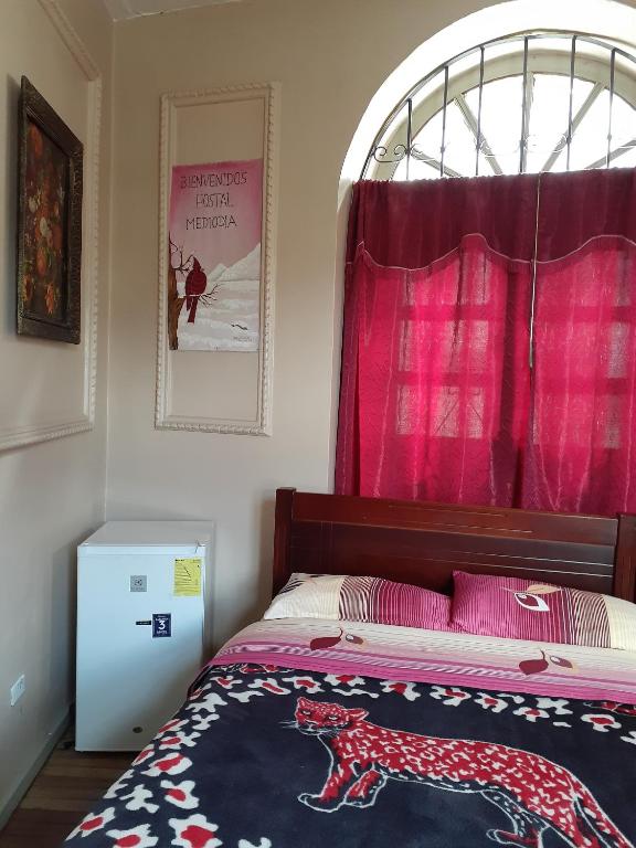 Postel nebo postele na pokoji v ubytování Hostal Mediodia