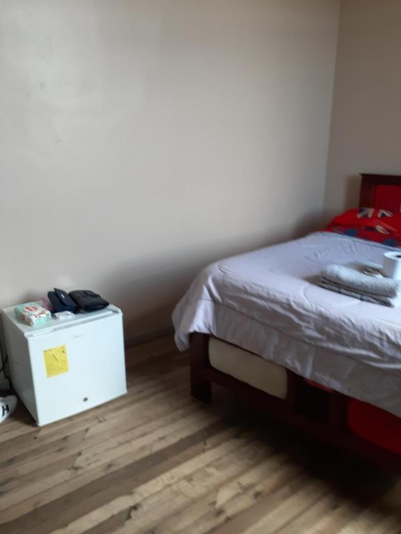 Postel nebo postele na pokoji v ubytování Hostal Mediodia