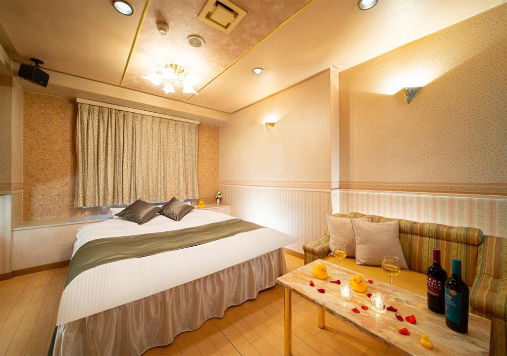 Postel nebo postele na pokoji v ubytování HOTEL&SPA SIESTA ( Adult Only)