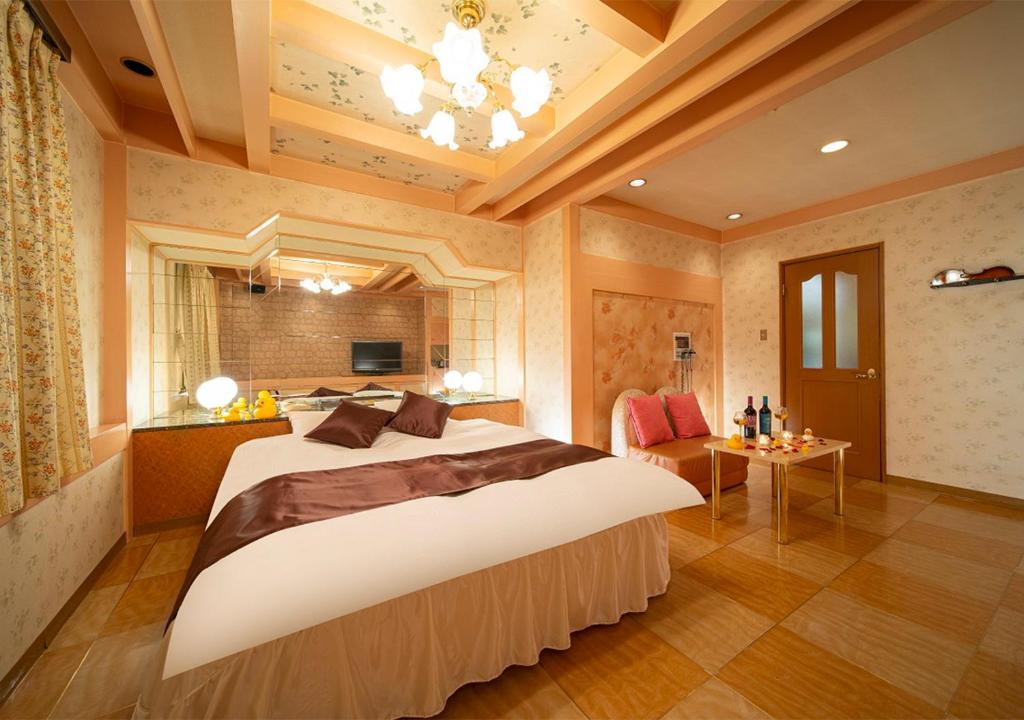 Postel nebo postele na pokoji v ubytování HOTEL&SPA SIESTA ( Adult Only)