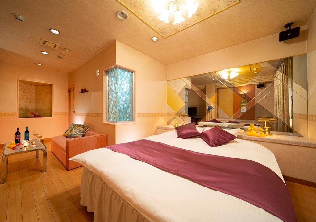Postel nebo postele na pokoji v ubytování HOTEL&SPA SIESTA ( Adult Only)