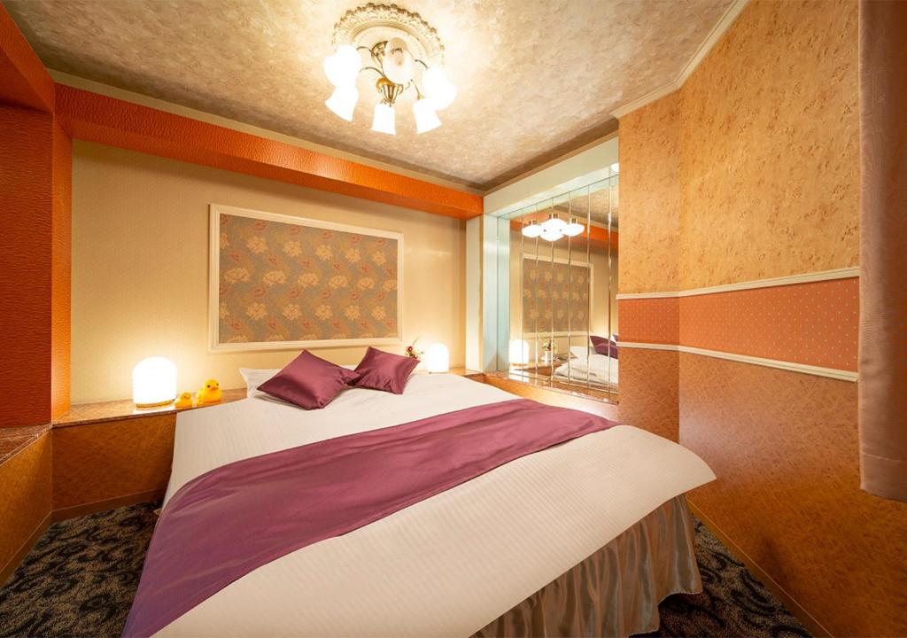 Postel nebo postele na pokoji v ubytování HOTEL&SPA SIESTA ( Adult Only)