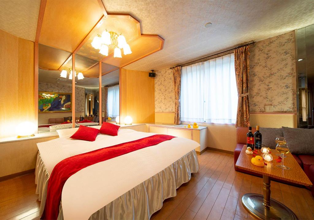 Postel nebo postele na pokoji v ubytování HOTEL&SPA SIESTA ( Adult Only)
