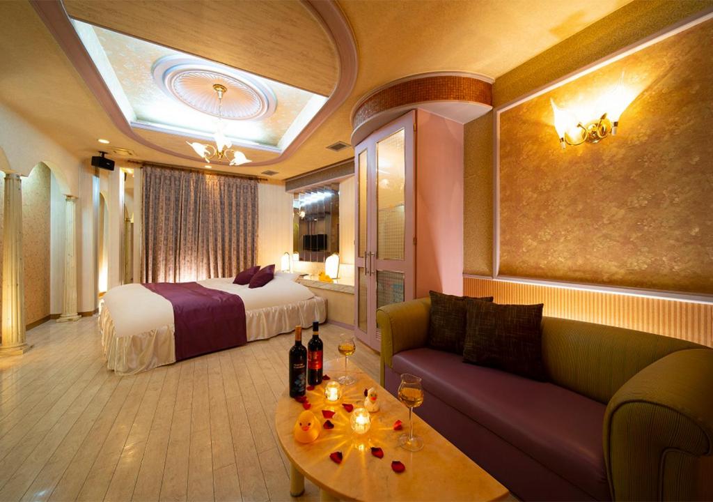 Postel nebo postele na pokoji v ubytování HOTEL&SPA SIESTA ( Adult Only)