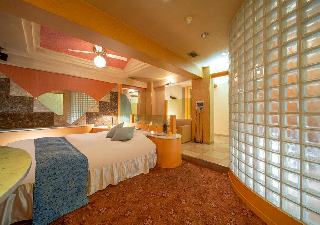 Postel nebo postele na pokoji v ubytování HOTEL&SPA SIESTA ( Adult Only)