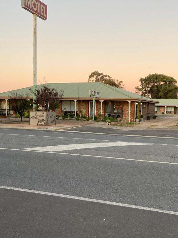 an empty street in front of a motel at Lake Albert Motel in Meningie