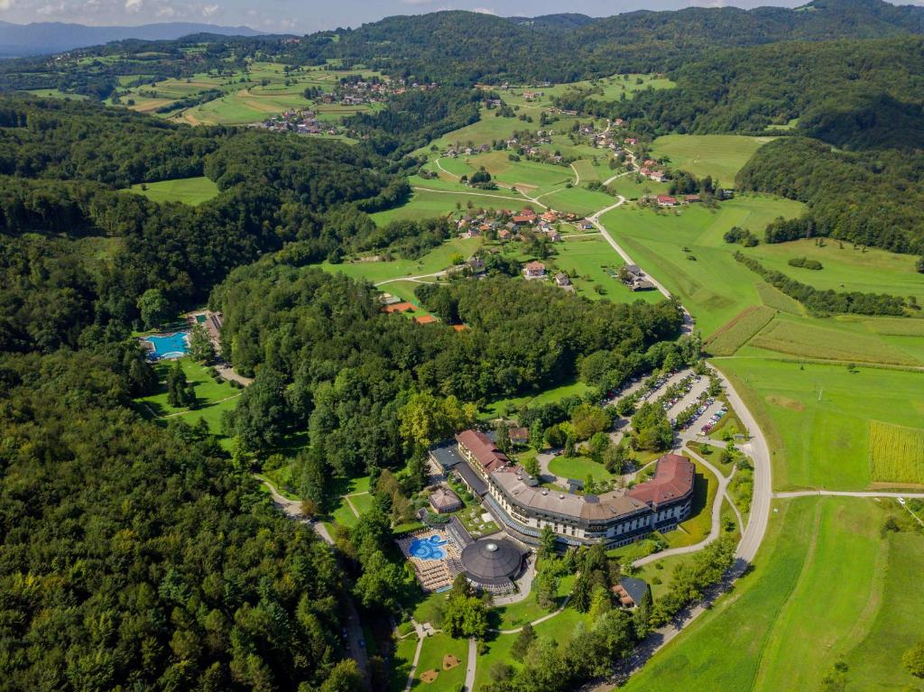 an aerial view of a mansion in the middle of a forest at Hotel Vitarium Superior - Terme Krka in Smarjeske Toplice