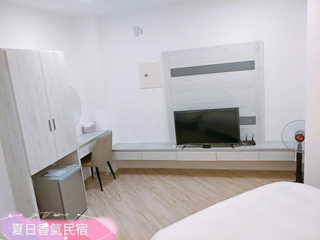 TV a/nebo společenská místnost v ubytování Penghu Summer Aroma Homestay
