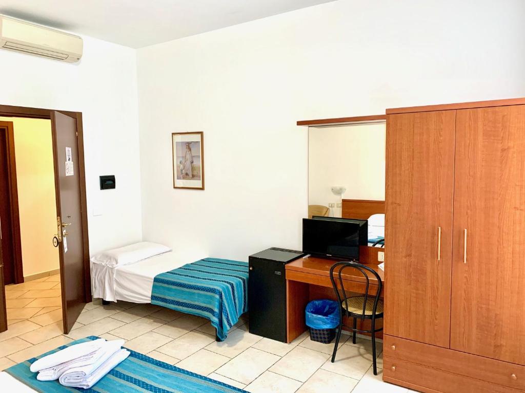 Posteľ alebo postele v izbe v ubytovaní Hotel Alessander
