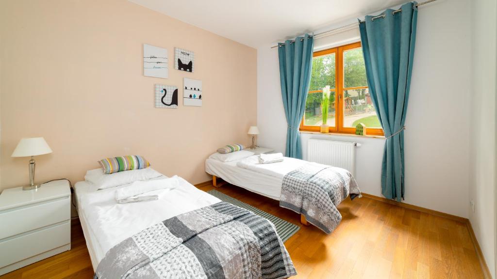 Posteľ alebo postele v izbe v ubytovaní Apartamenty Sun & Snow Karpacz Myśliwska