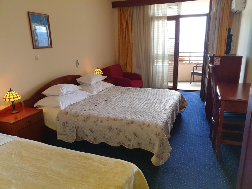 Postel nebo postele na pokoji v ubytování Hotel Miramare
