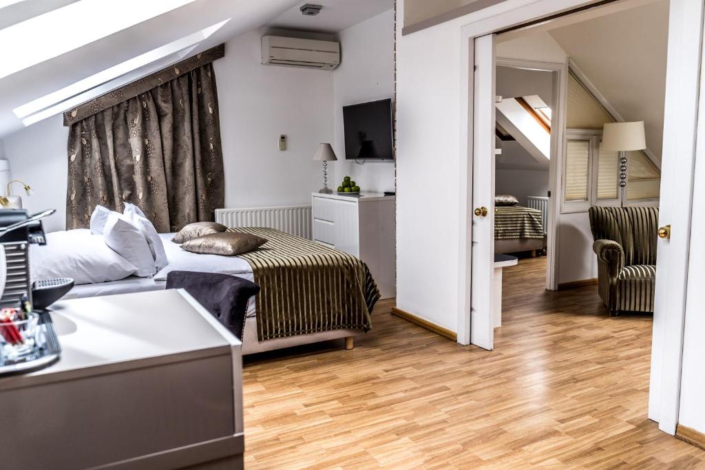 Postel nebo postele na pokoji v ubytování Hotel Julian