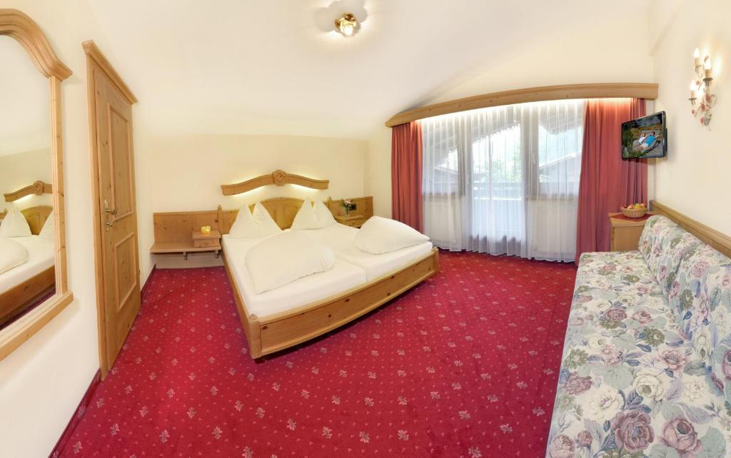 Postel nebo postele na pokoji v ubytování Hotel Rose