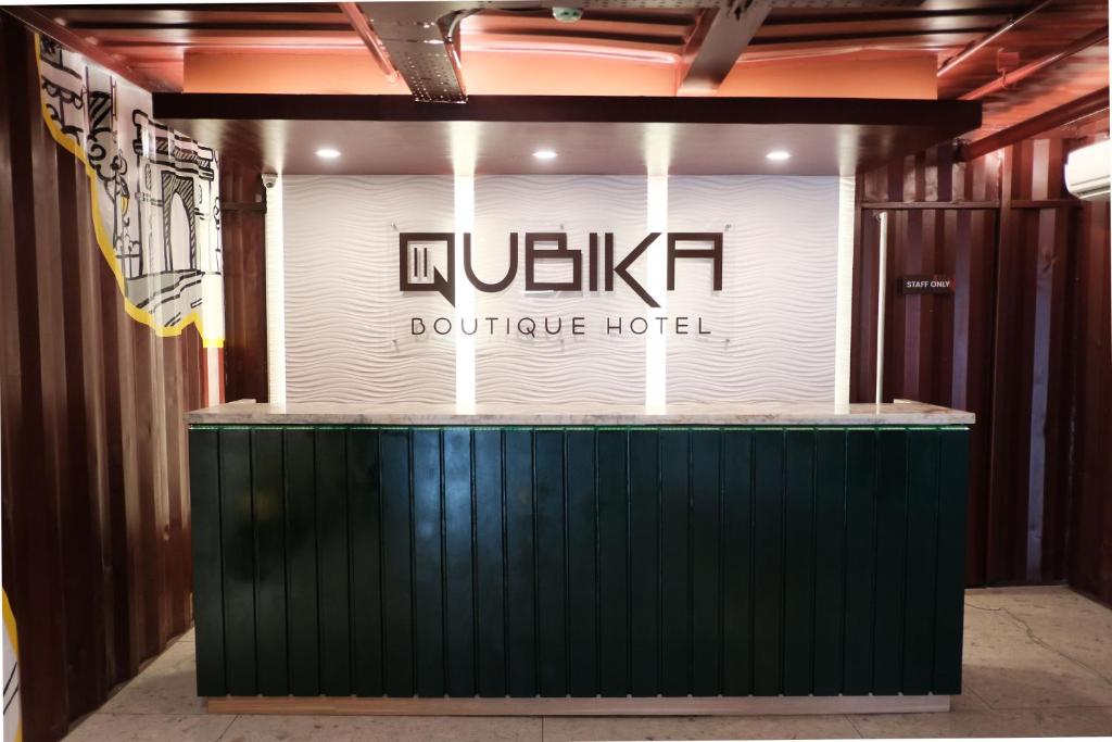 a sign for a boutique hotel in a building at QUBIKA BOUTIQUE HOTEL in Tangerang