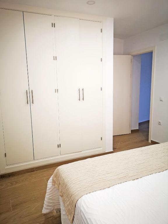 Postel nebo postele na pokoji v ubytování AG Apartamentos en Conil