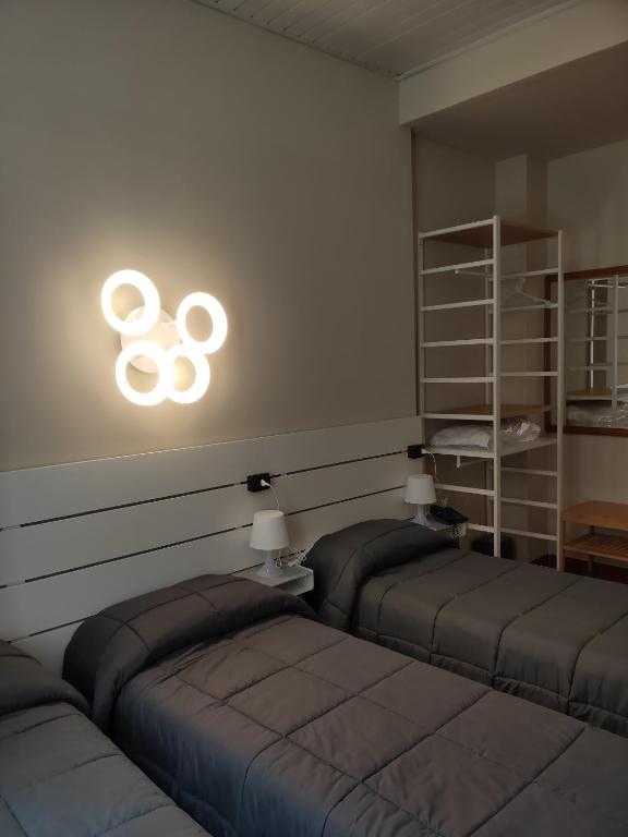 Postel nebo postele na pokoji v ubytování Hotel La Vignetta