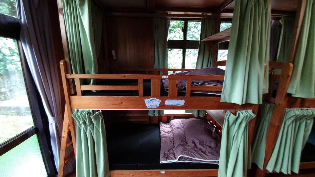 Postel nebo postele na pokoji v ubytování Kerama Backpackers
