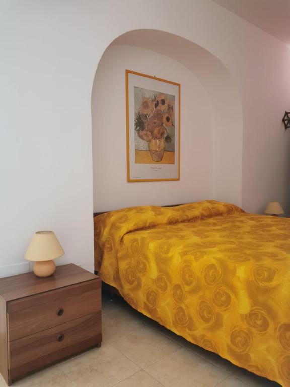 Postel nebo postele na pokoji v ubytování ANFORA Giallo