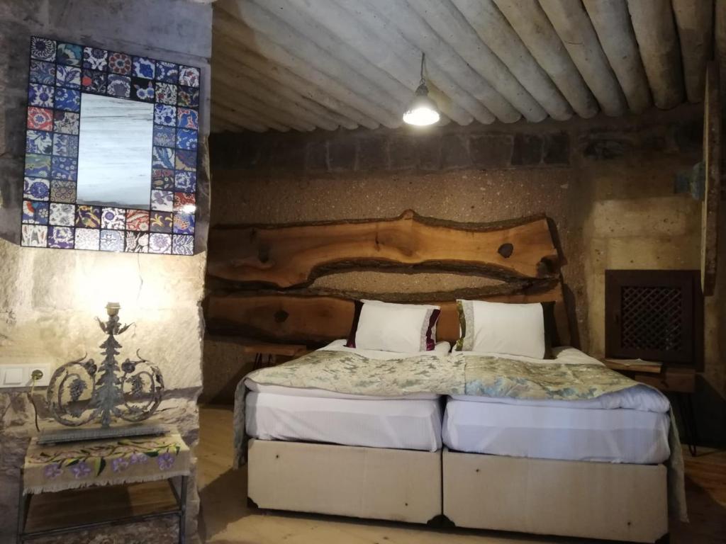 Postel nebo postele na pokoji v ubytování Pigeon Hotel Cappadocia