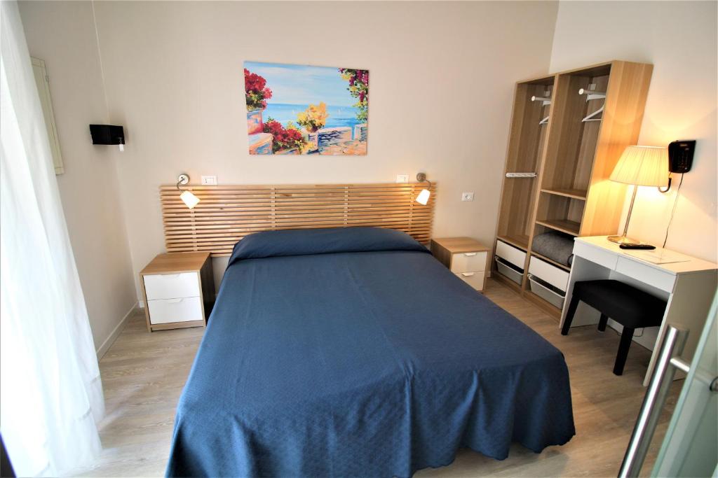 Postel nebo postele na pokoji v ubytování Hotel Firenze