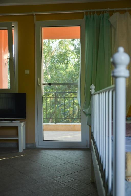TV a/nebo společenská místnost v ubytování PortoAgali