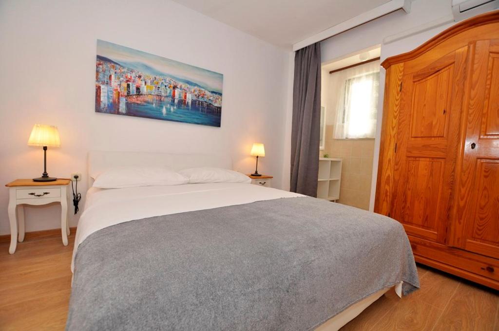 Postel nebo postele na pokoji v ubytování Apartmani More