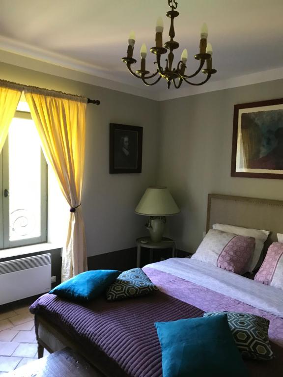 Letto o letti in una camera di Residence le Petit Paradis