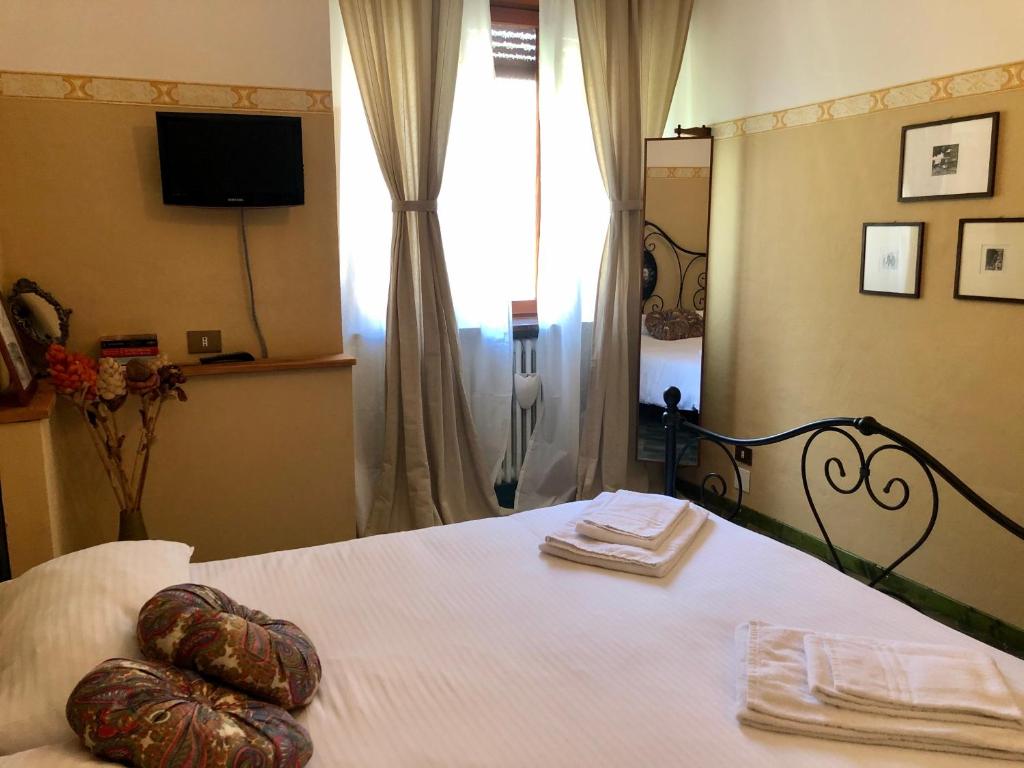 Postel nebo postele na pokoji v ubytování Appartamenti La Menaresta quiet & relax near Bellagio