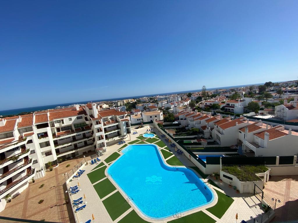 an aerial view of an apartment complex with a swimming pool at Algarve Vacations Flat in Albufeira