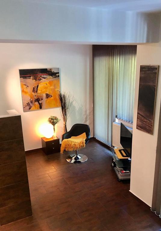 TV a/nebo společenská místnost v ubytování Apartmány Kolonáda