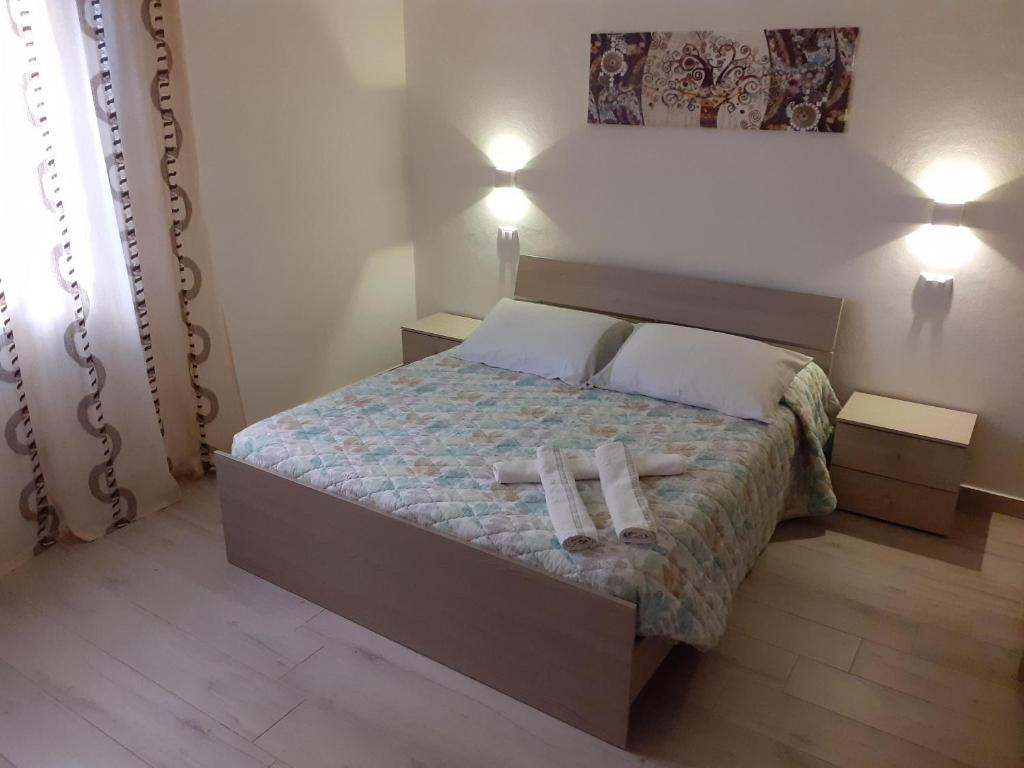 Posteľ alebo postele v izbe v ubytovaní Bilocale indipendente a pochi passi dal mare di Rimini