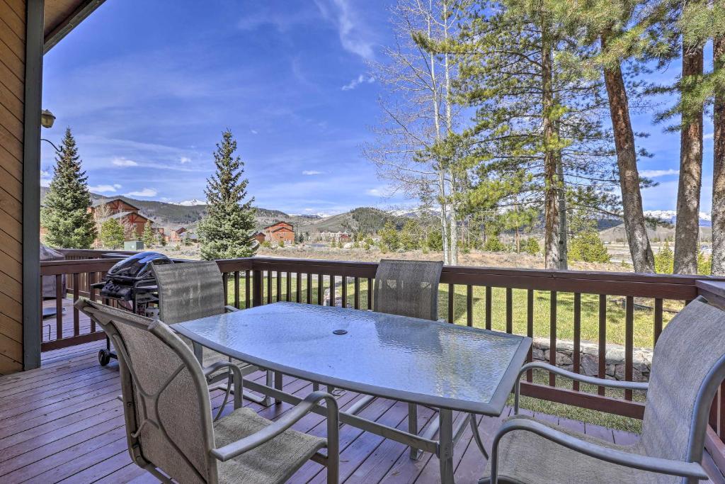 a patio with a table and chairs on a deck at 2 Mi to Lake Dillon Spacious Condo with Mtn Views in Dillon