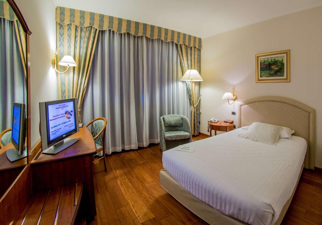 Postel nebo postele na pokoji v ubytování Best Western Hotel Globus City
