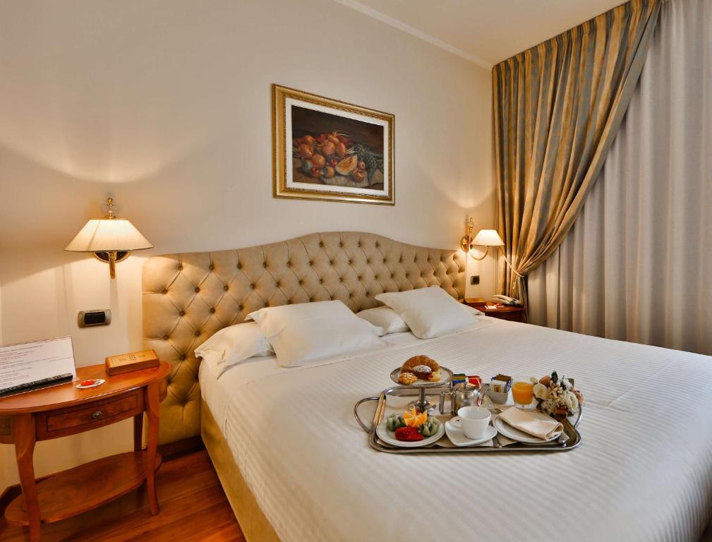 Postel nebo postele na pokoji v ubytování Best Western Hotel Globus City