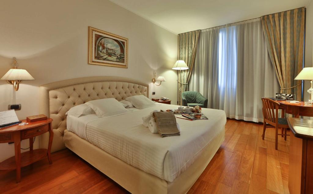 Postel nebo postele na pokoji v ubytování Best Western Hotel Globus City