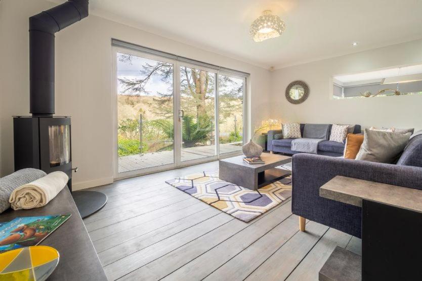 a living room with a couch and a fireplace at Valley View in Paul