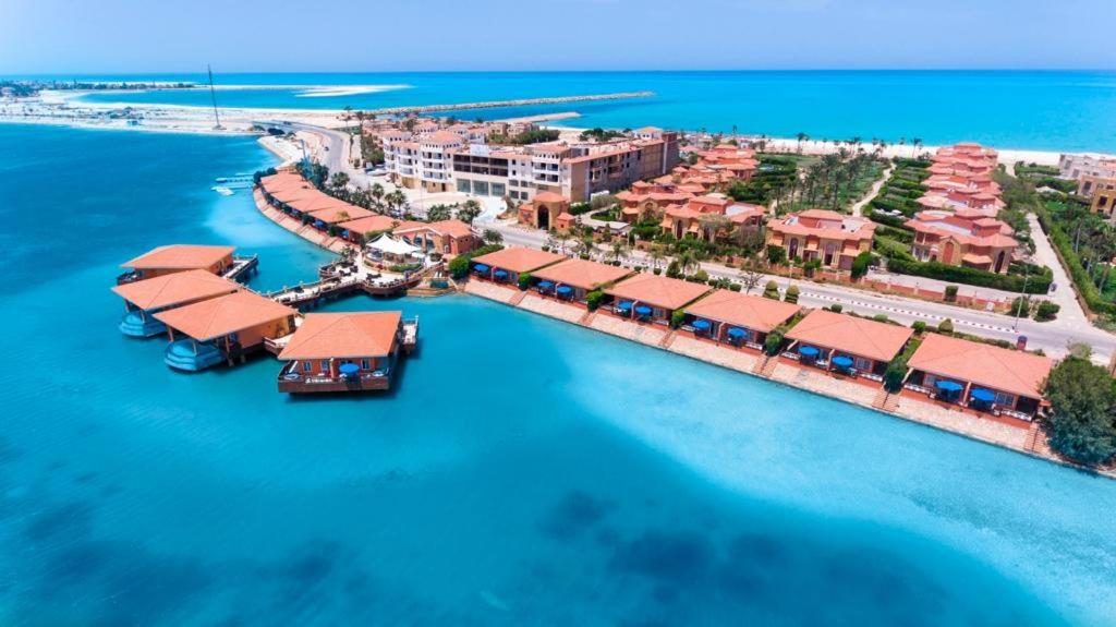 an aerial view of a resort on the water at Golden Ocean Marina Hotel in El Alamein